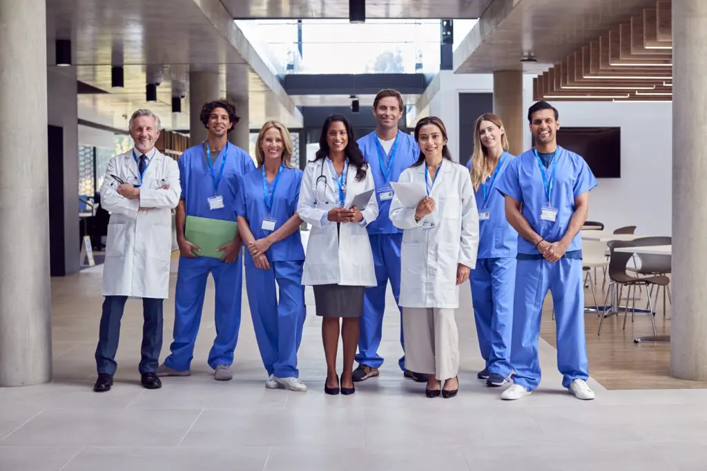 Medical team standing in a hospital corridor.